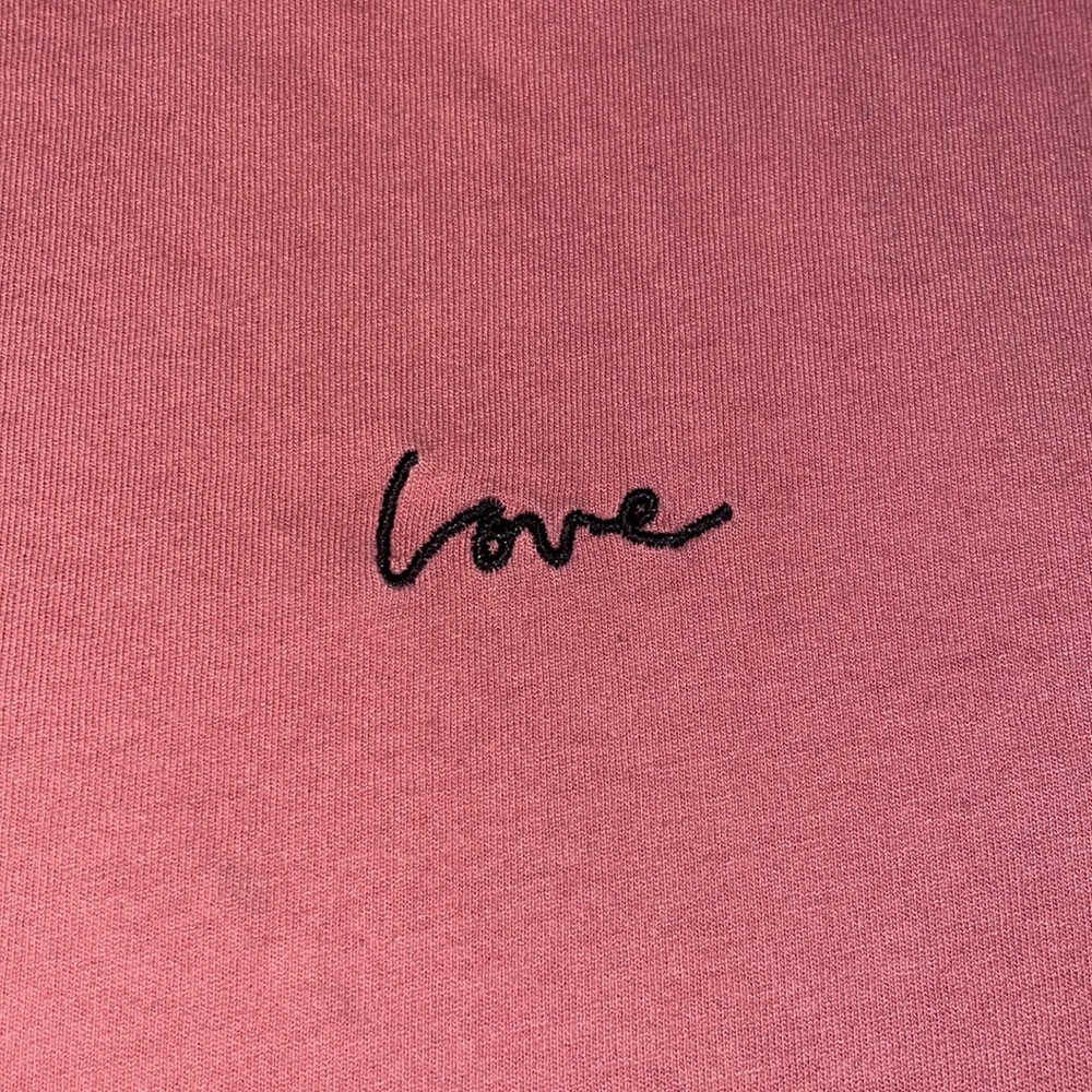 - pink h&m top with the word love embroidered on front